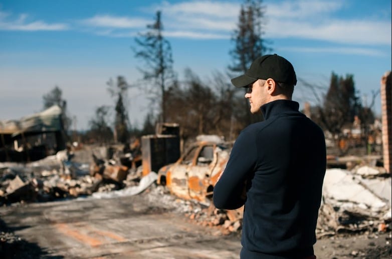 Man Looking At The After Effect Of A Calamity