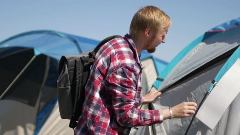 Man Outside A Tent