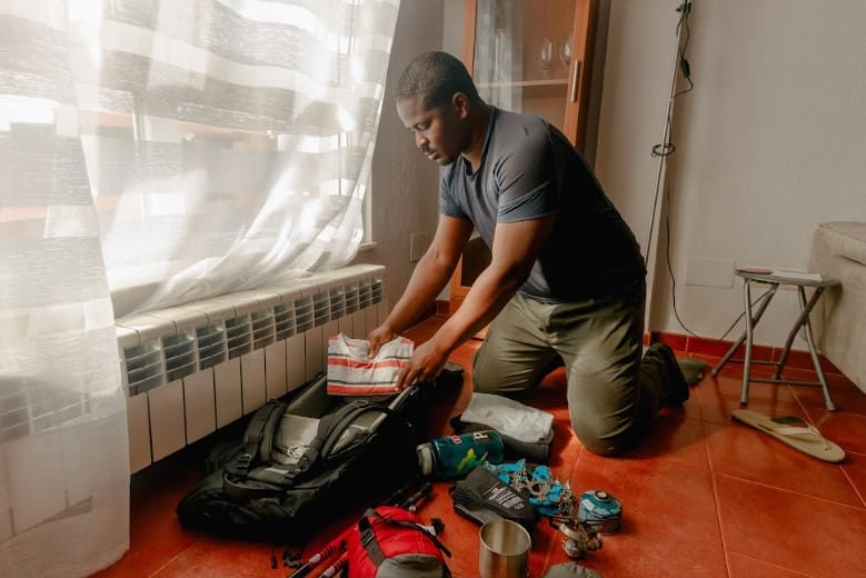 Man Storing Supplies After Disaster